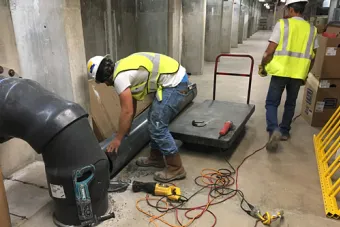 vendor resources photo of workers maintaining air system