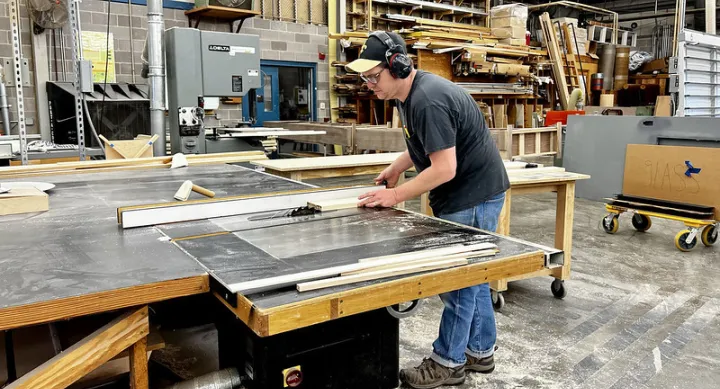 Zach LeBlanc working in the Campus Construction Carpentry Shop